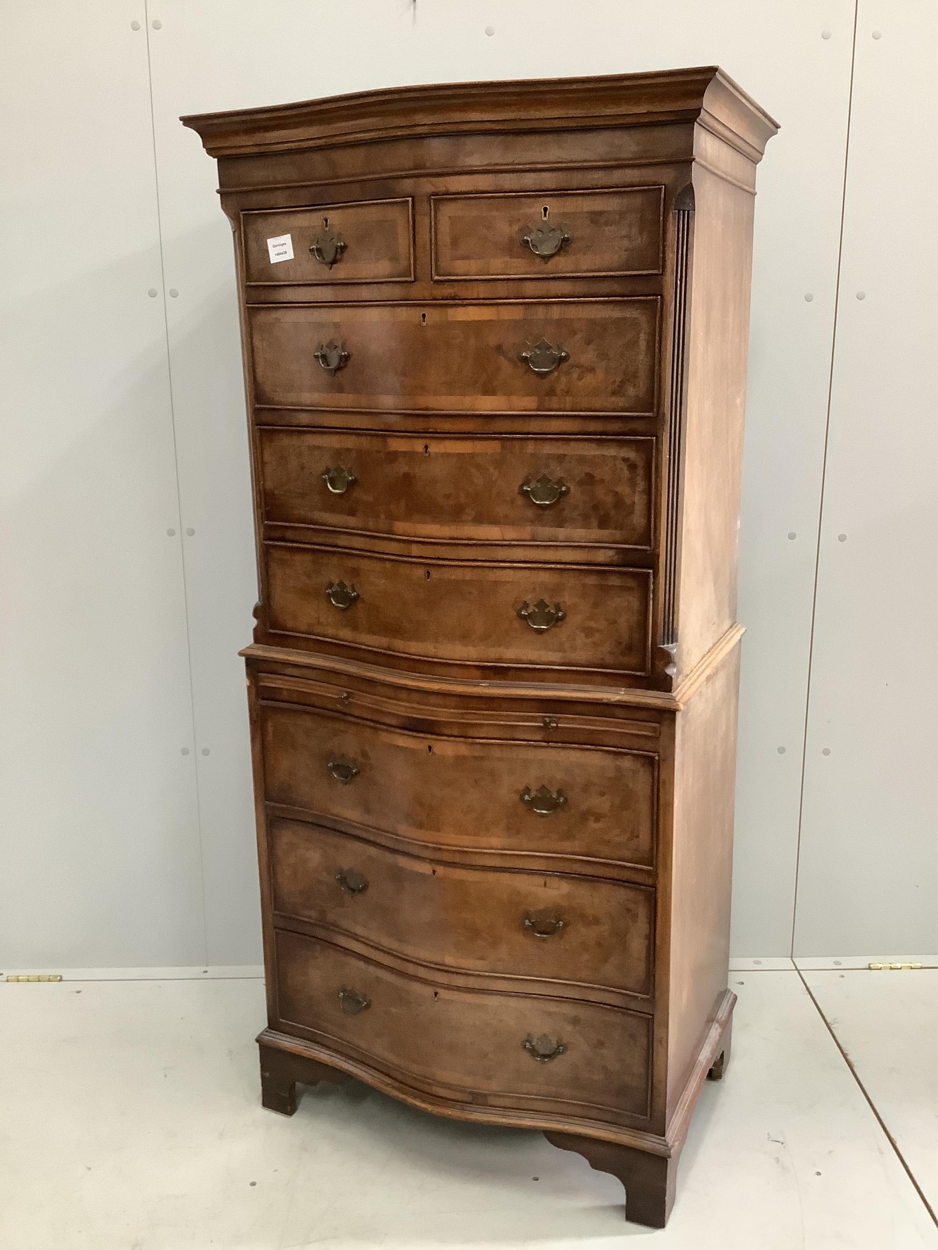 A reproduction George III style mahogany serpentine chest on chest, width 72cm, depth 48cm, height 156cm. Condition - fair
